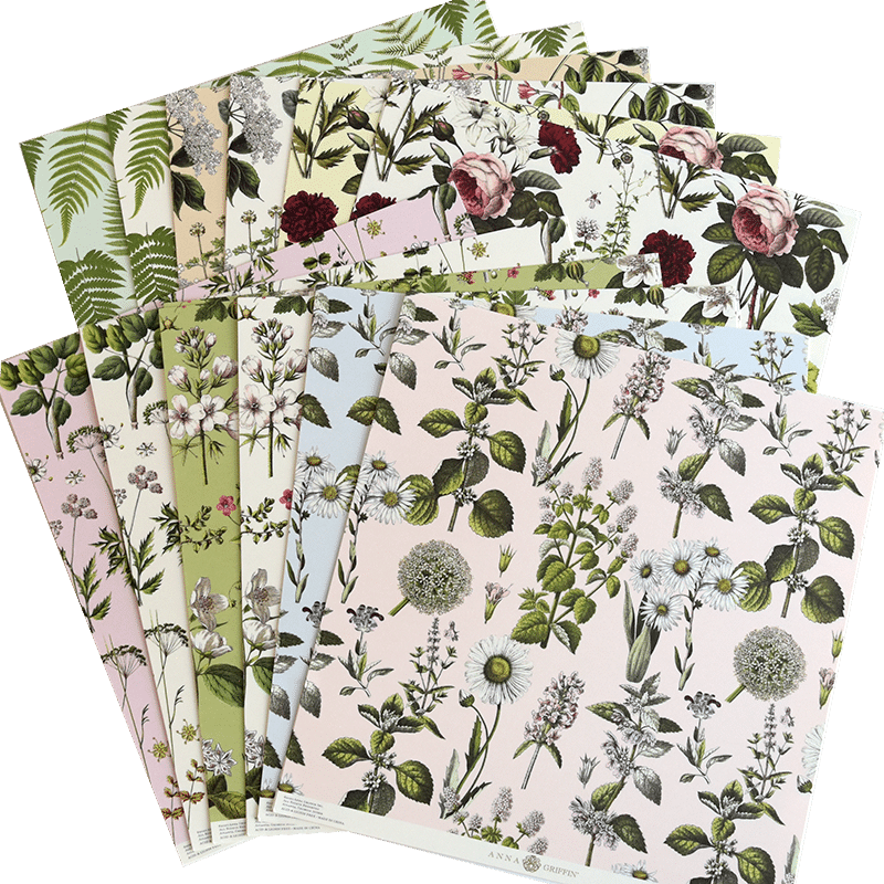 a bunch of papers with flowers on them.