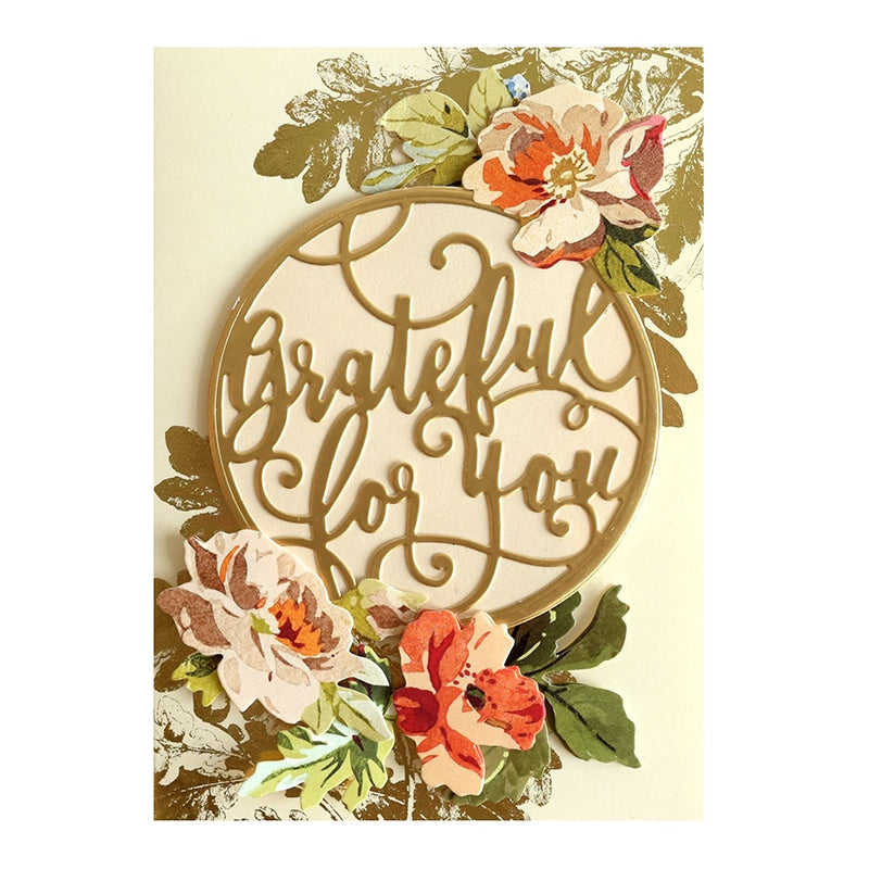 a wooden sign that says grateful for you surrounded by flowers.