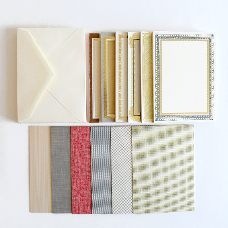 a group of different types of cards and envelopes.