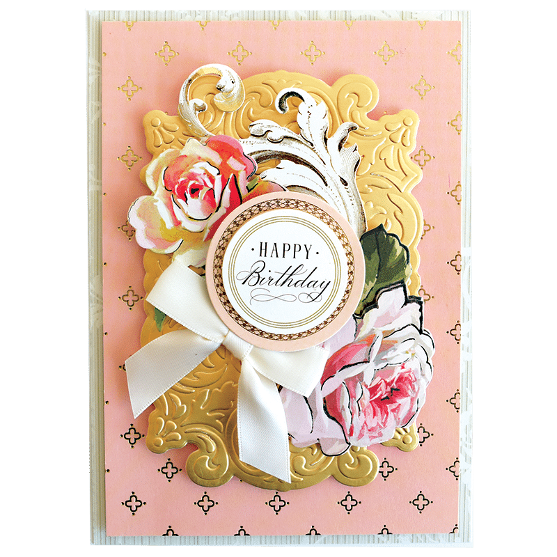 a pink and gold birthday card with flowers.