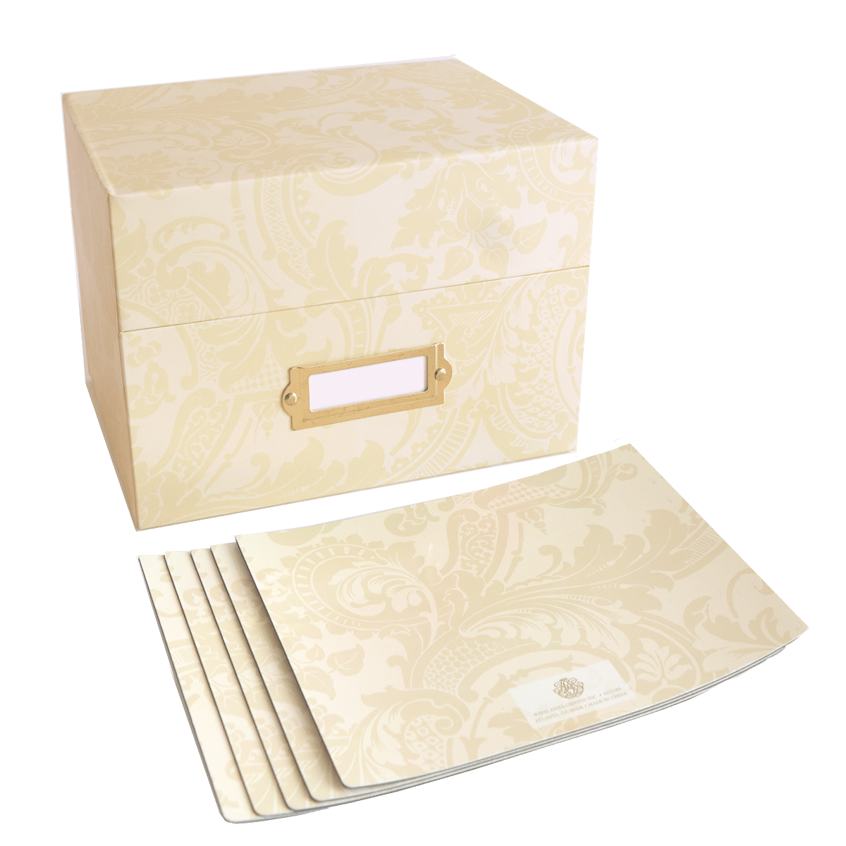 a set of four white boxes with a gold handle.