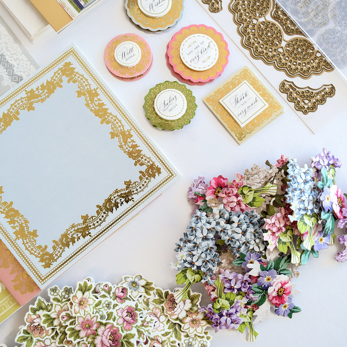 a table topped with lots of different types of paper.
