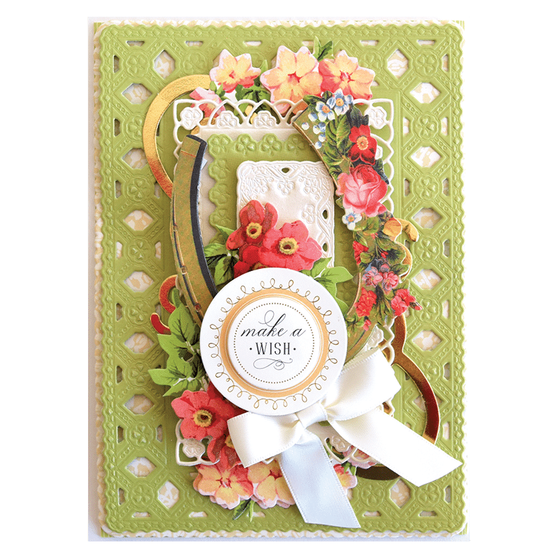 a card with flowers and a ribbon on it.