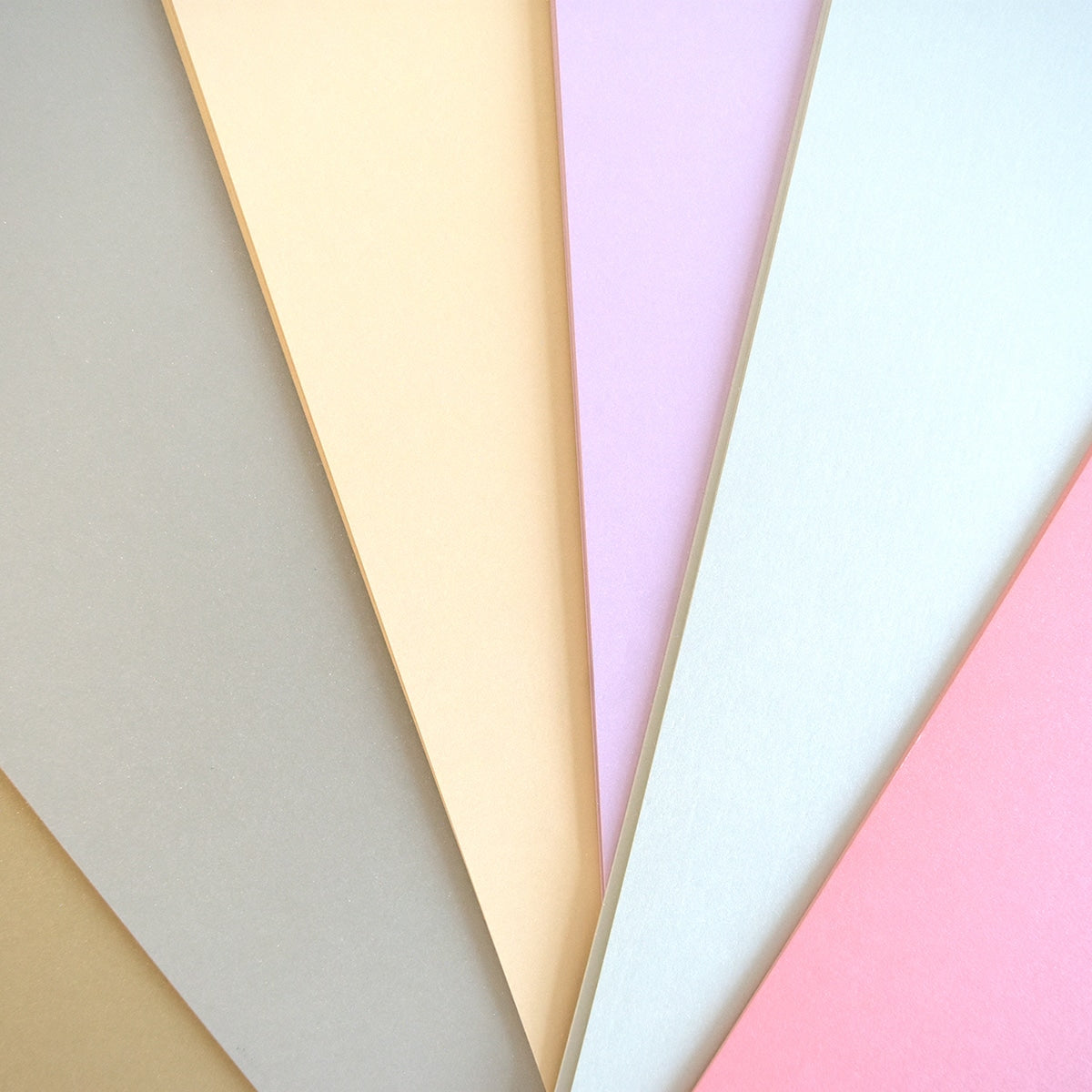 a group of different colored papers sitting next to each other.