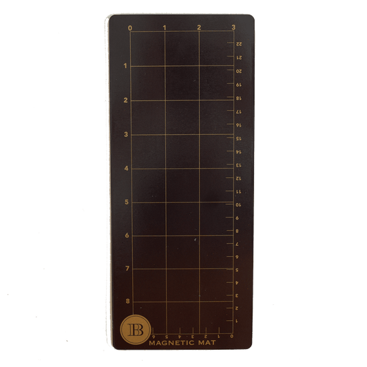 a brown magnetic mat with a ruler on it.