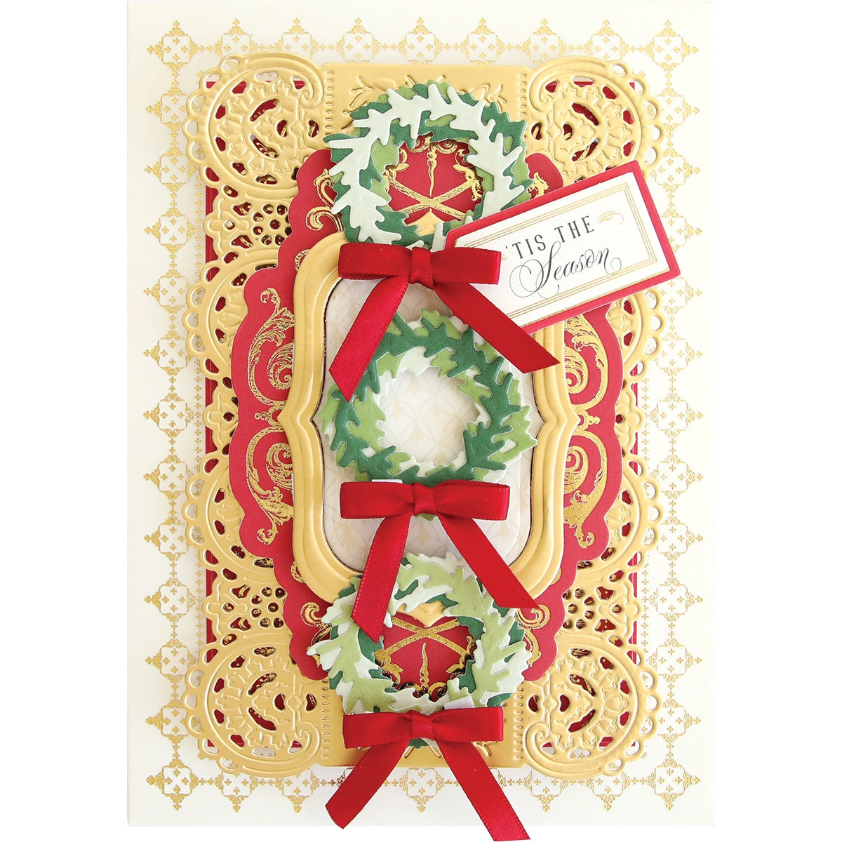 a handmade christmas card with a red ribbon.