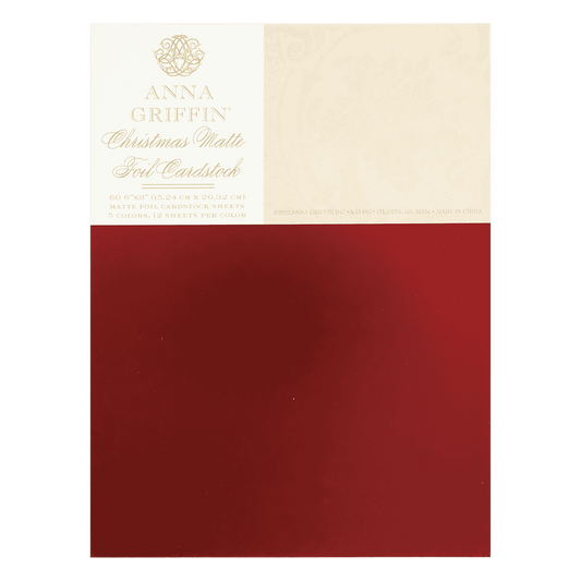 a piece of red and white paper with a gold emblem.