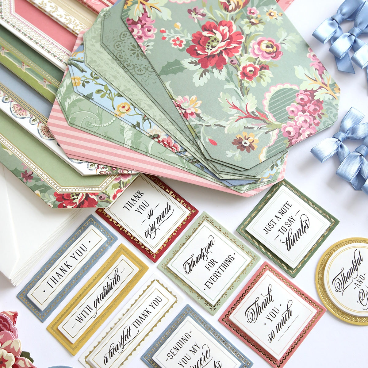 Simply Gratitude Card Making Kit cards and papers are laid out on a table.