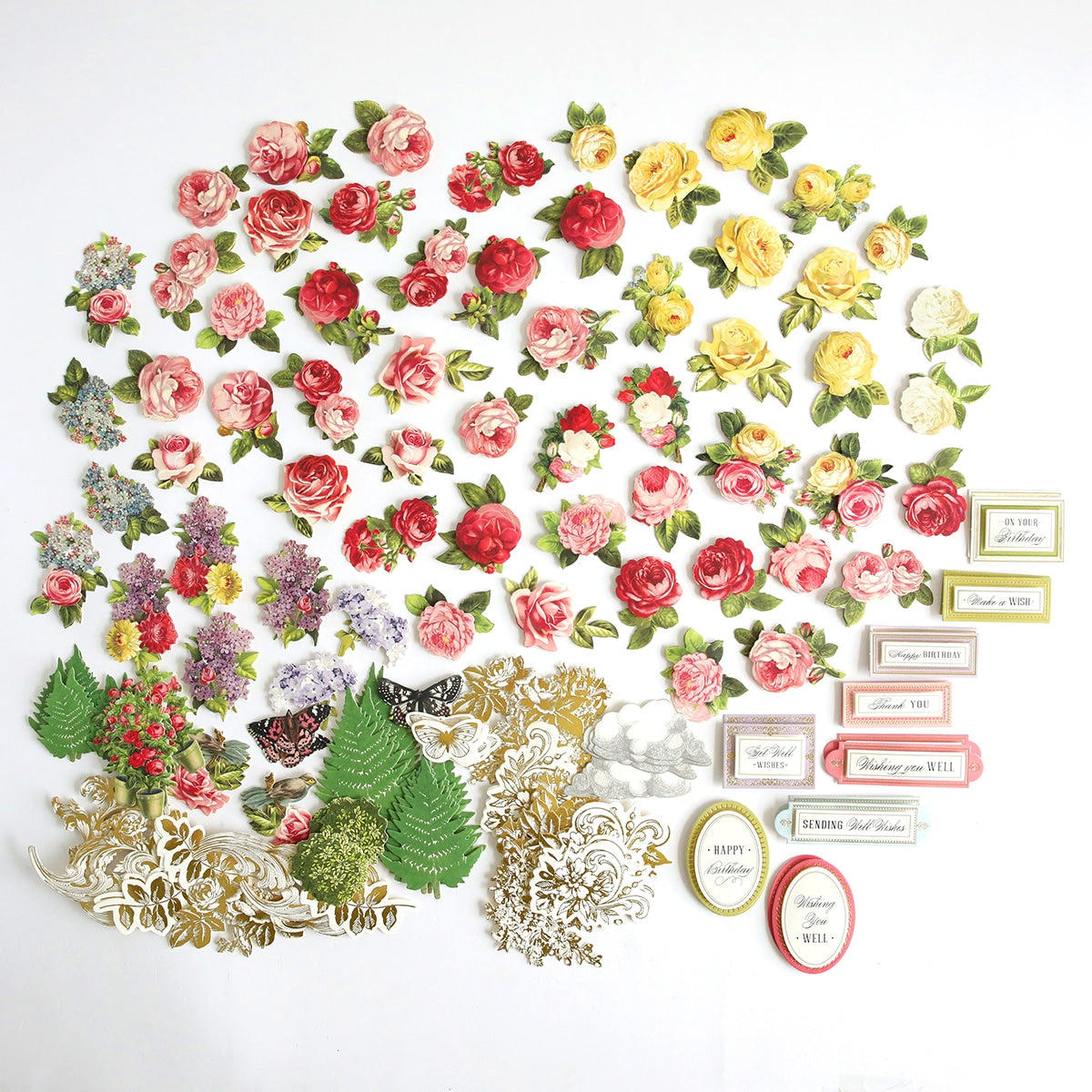 A large arrangement of Wishing Well Embellishments, leaves, and labels.