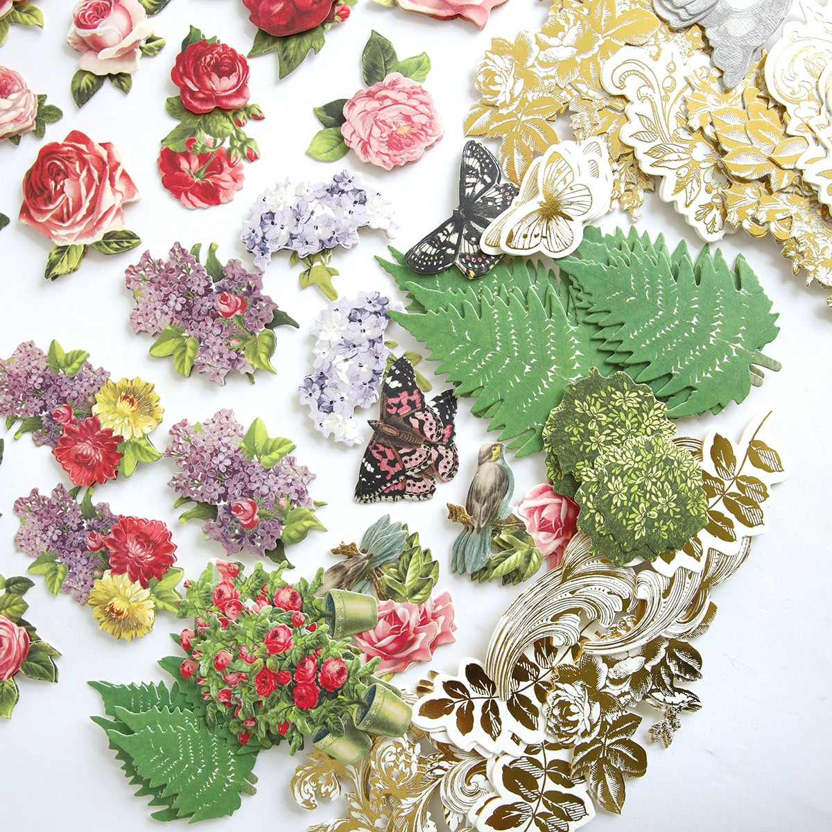 A bunch of Wishing Well Embellishments arranged on a table.