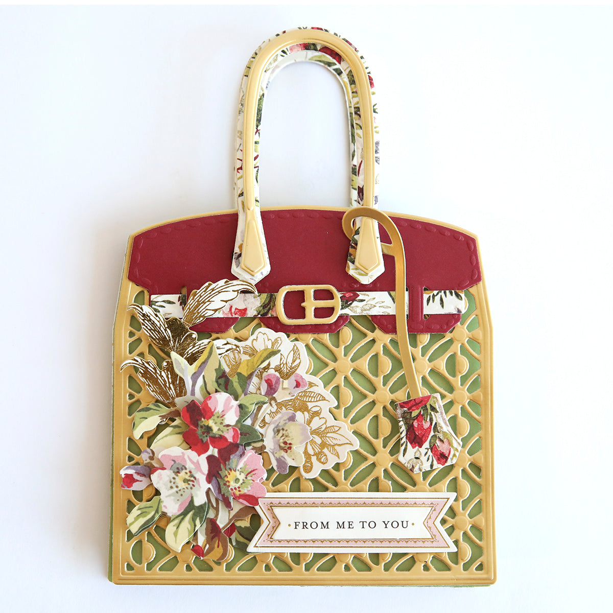 a handbag hanging on a wall with flowers on it.