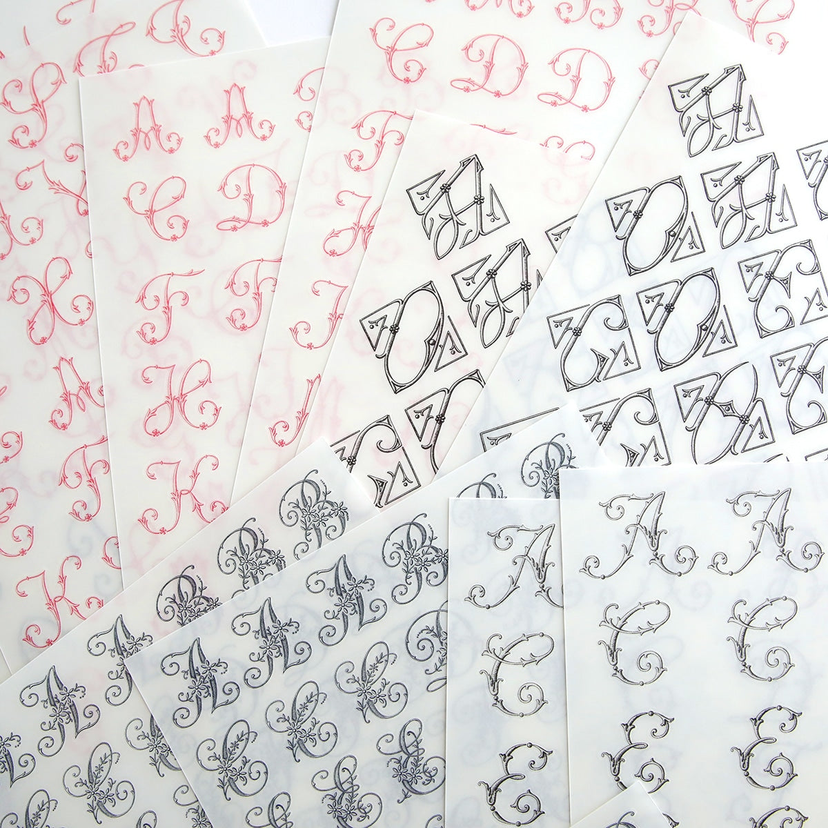 A collection of high quality Monogram Rub Ons by Anna Griffin on personalized stationery, featuring various monogram designs.