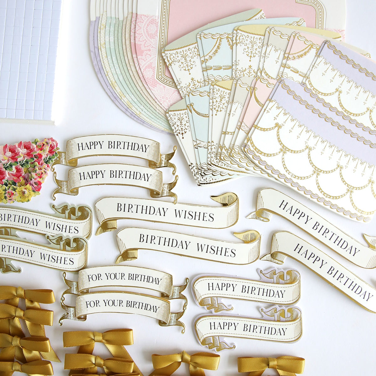 A collection of Simply Rocking Birthday Card Kit and ribbons on a table.