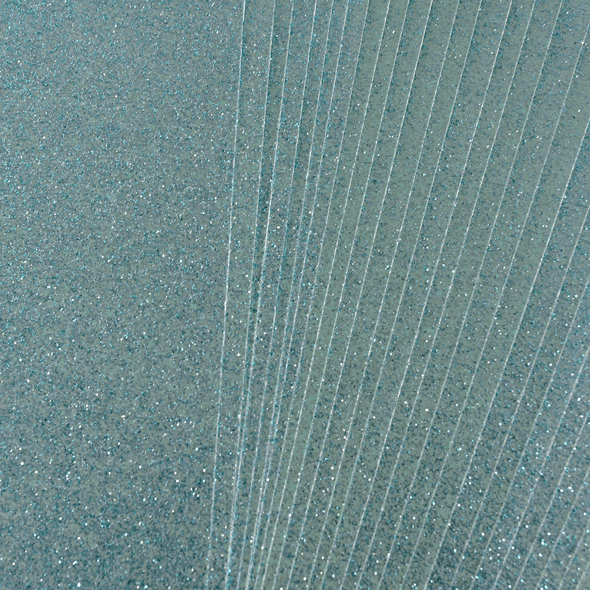 a shower head with water running down the side of it.