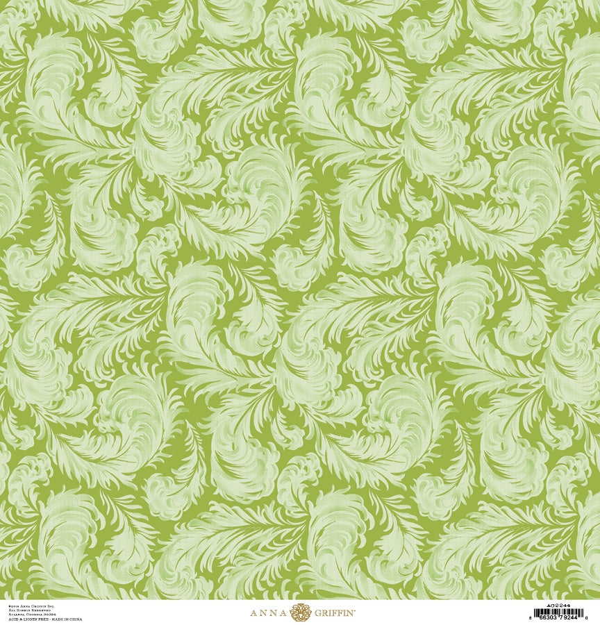 a green and white wallpaper with leaves.