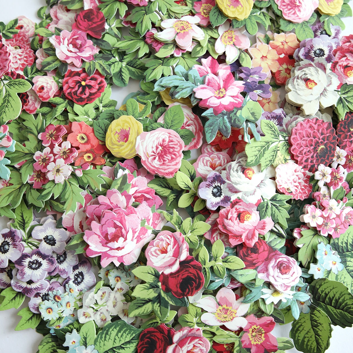 A Sympathy Sentiments and Mini Flowers Stickers that are on a table.