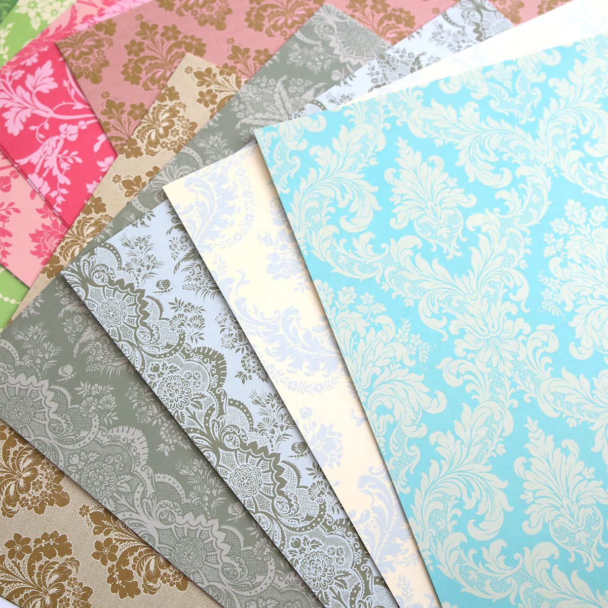 a bunch of different colored papers on a table.