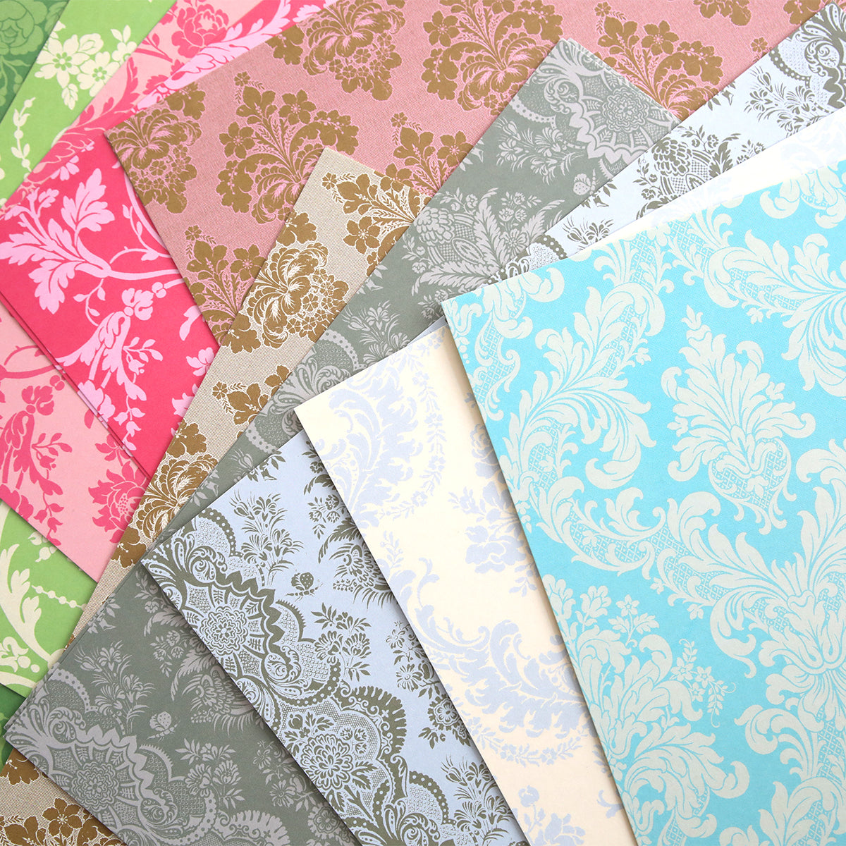 a bunch of different colors of paper on a table.