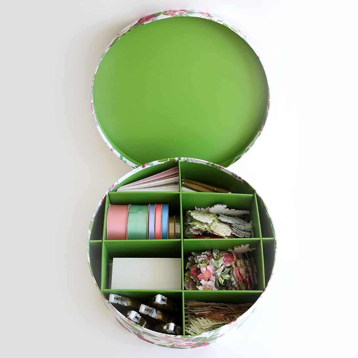 a green box filled with lots of different items.