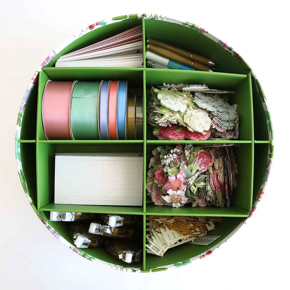 a green container filled with lots of different items.