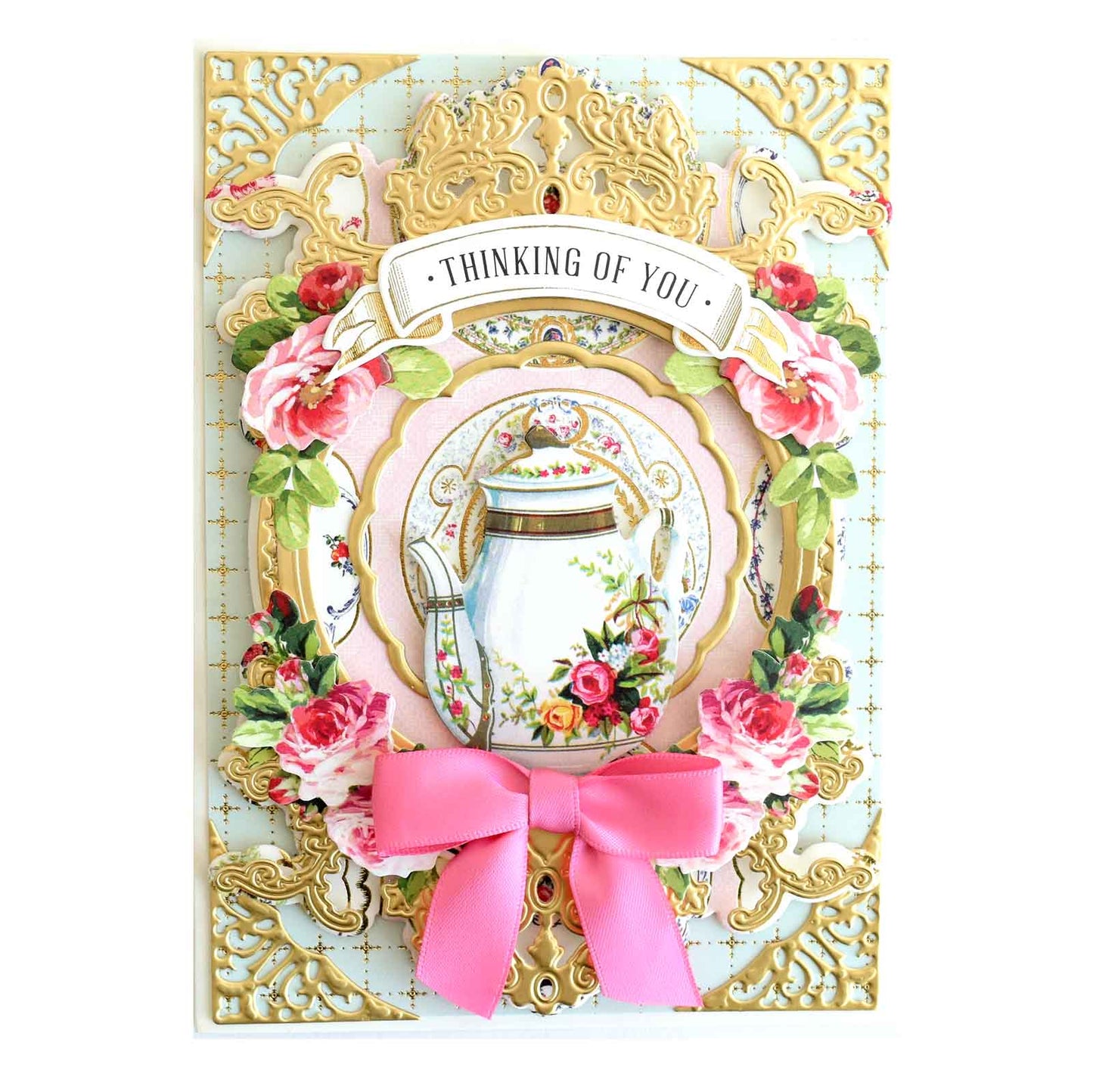 a card with a vase and a pink bow.