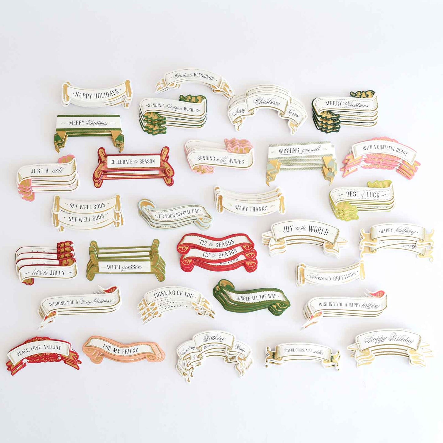 a bunch of different colored hair clips on a white surface.