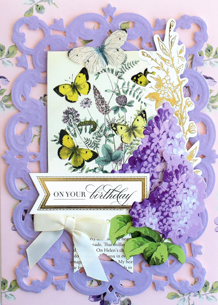 a close up of a card with flowers and butterflies.