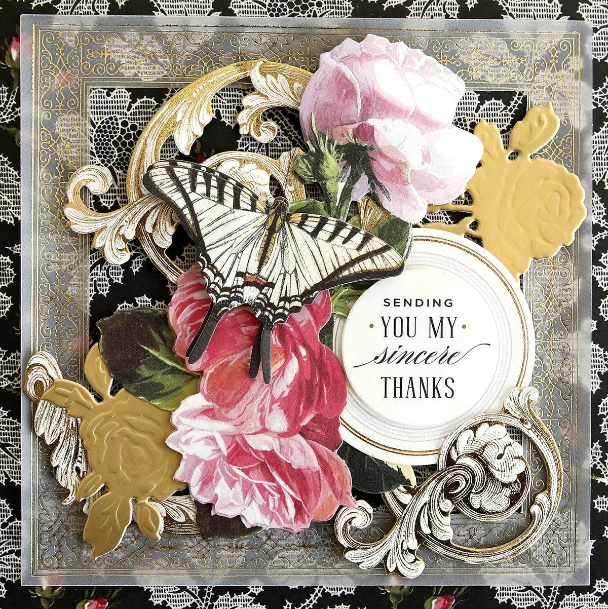 a close up of a card with flowers and a butterfly.