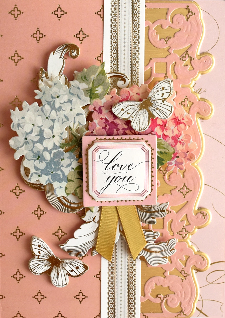 a close up of a card with flowers and butterflies.