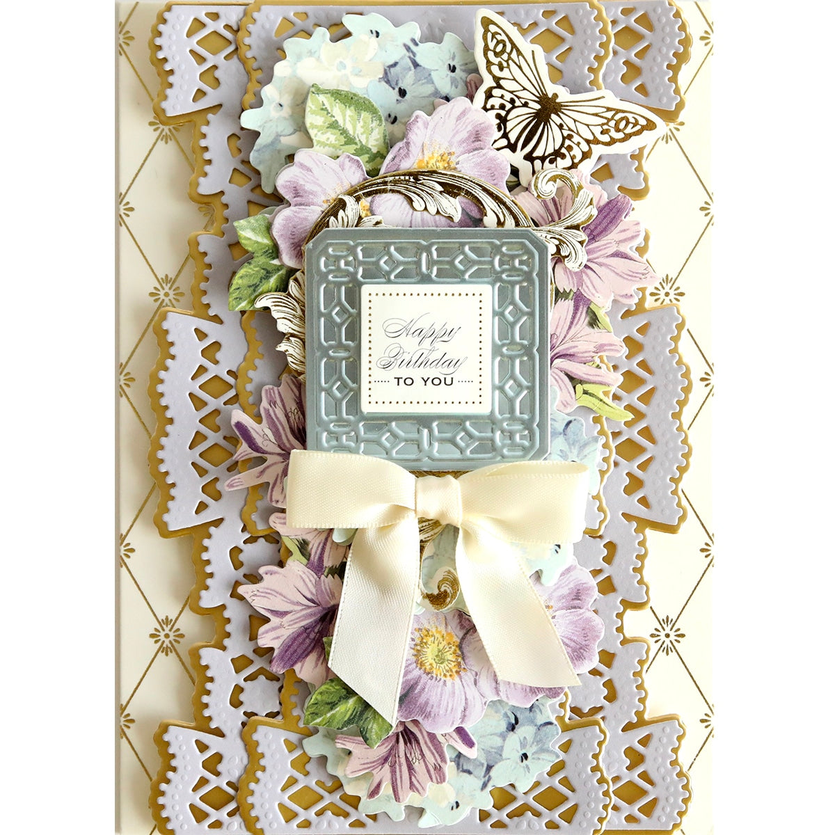 a Celebration Cartouche Cut & Emboss Folder with flowers and a bow.