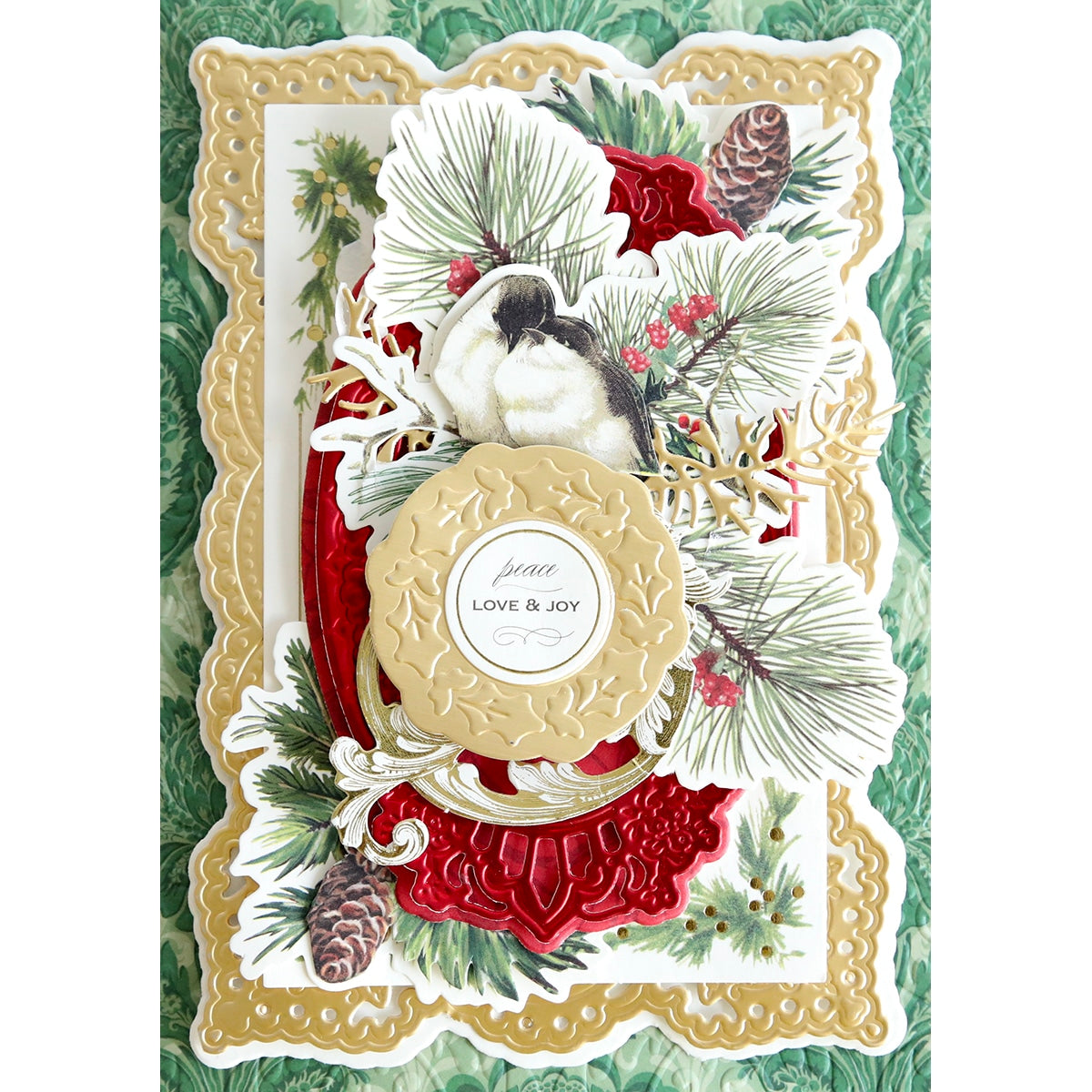 a Celebration Cartouche Cut & Emboss Folder with birds and pine cones.