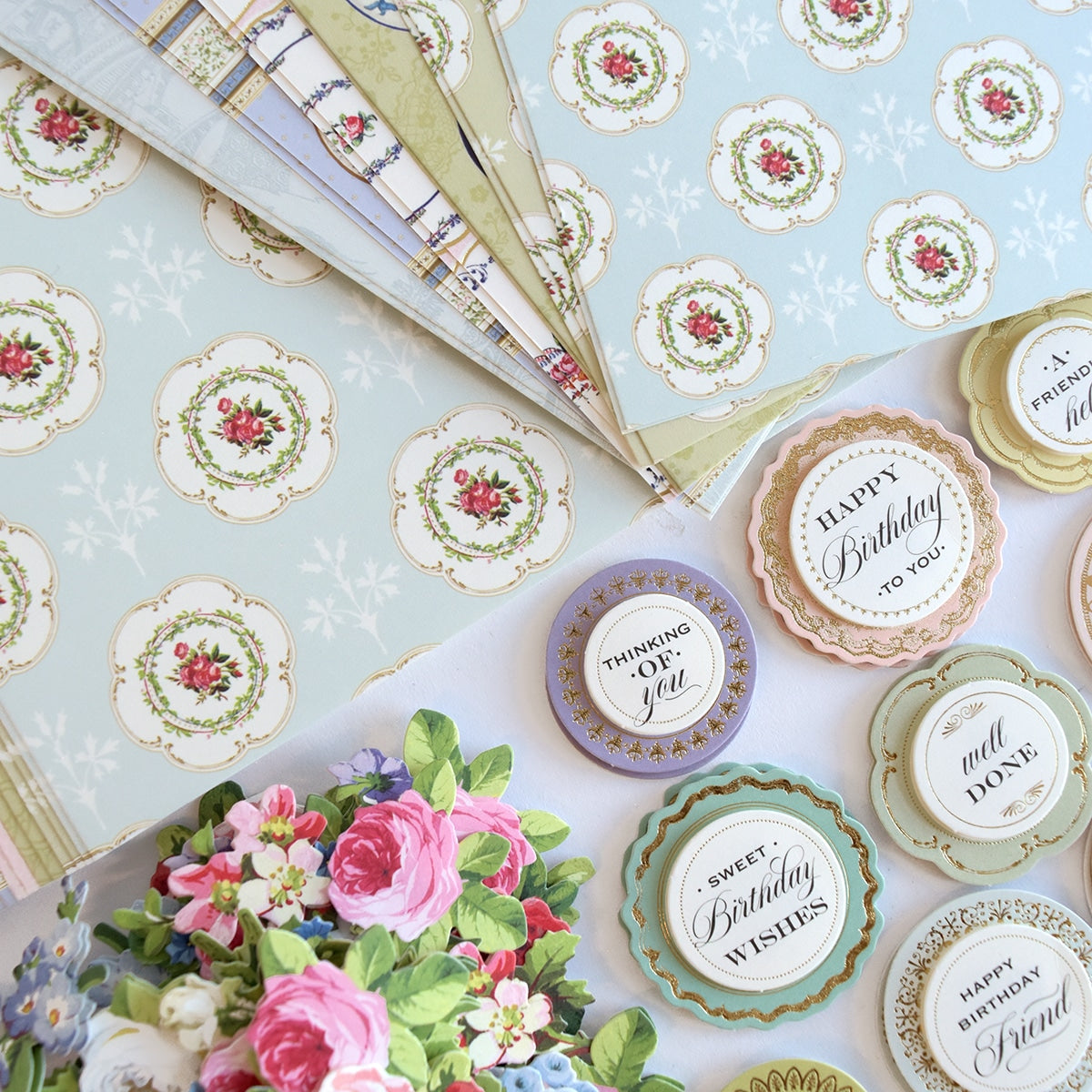 a table topped with lots of plates covered in paper.