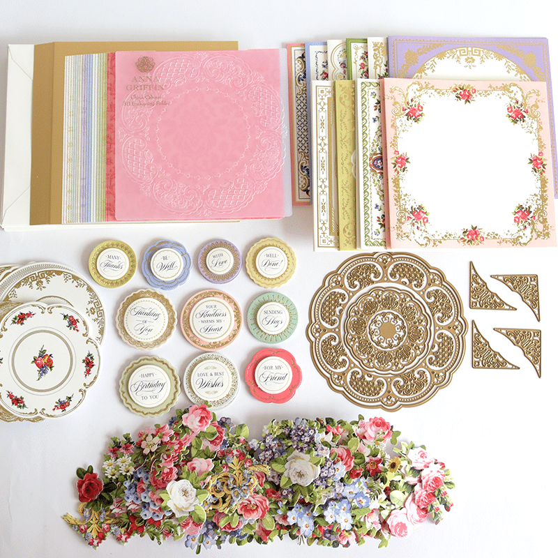 a table topped with lots of different types of paper.