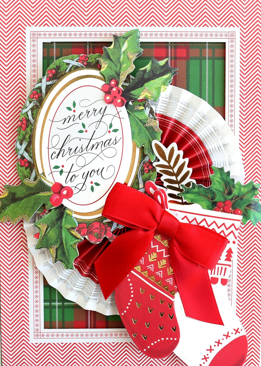 a close up of a christmas card with a paper plate.