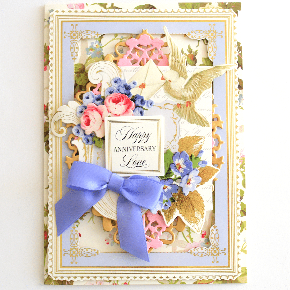 a happy anniversary card with a blue bow.