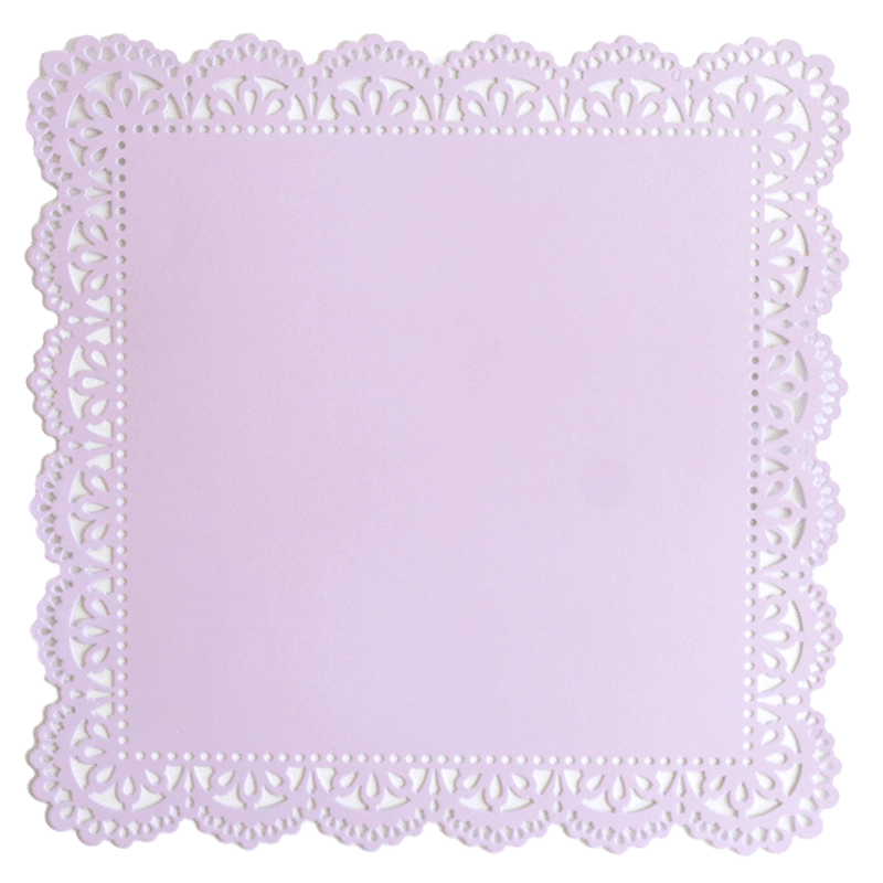 a white doily with a light pink background.