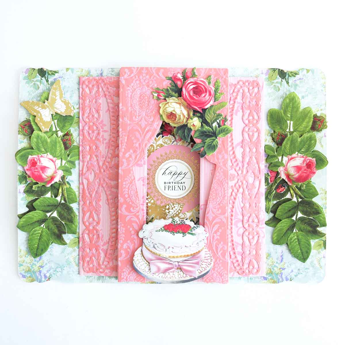 a card with a cake and flowers on it.