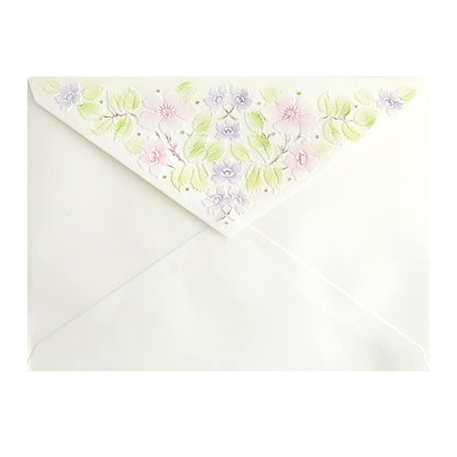 a white envelope with a floral design on it.