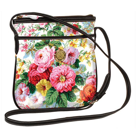 a flowered purse with a black strap.