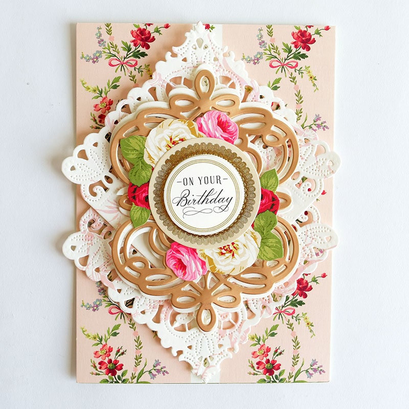 a handmade birthday card with a lace doily.