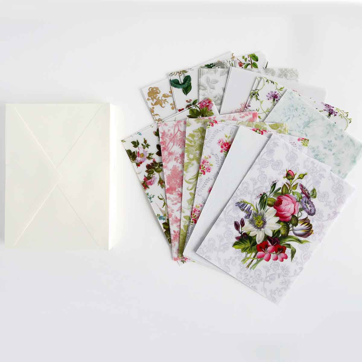 a white envelope with a bunch of flowers on it.