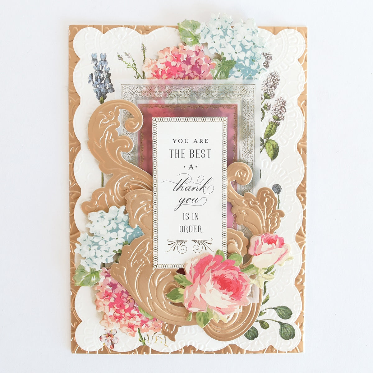 a card with a picture frame and flowers on it.