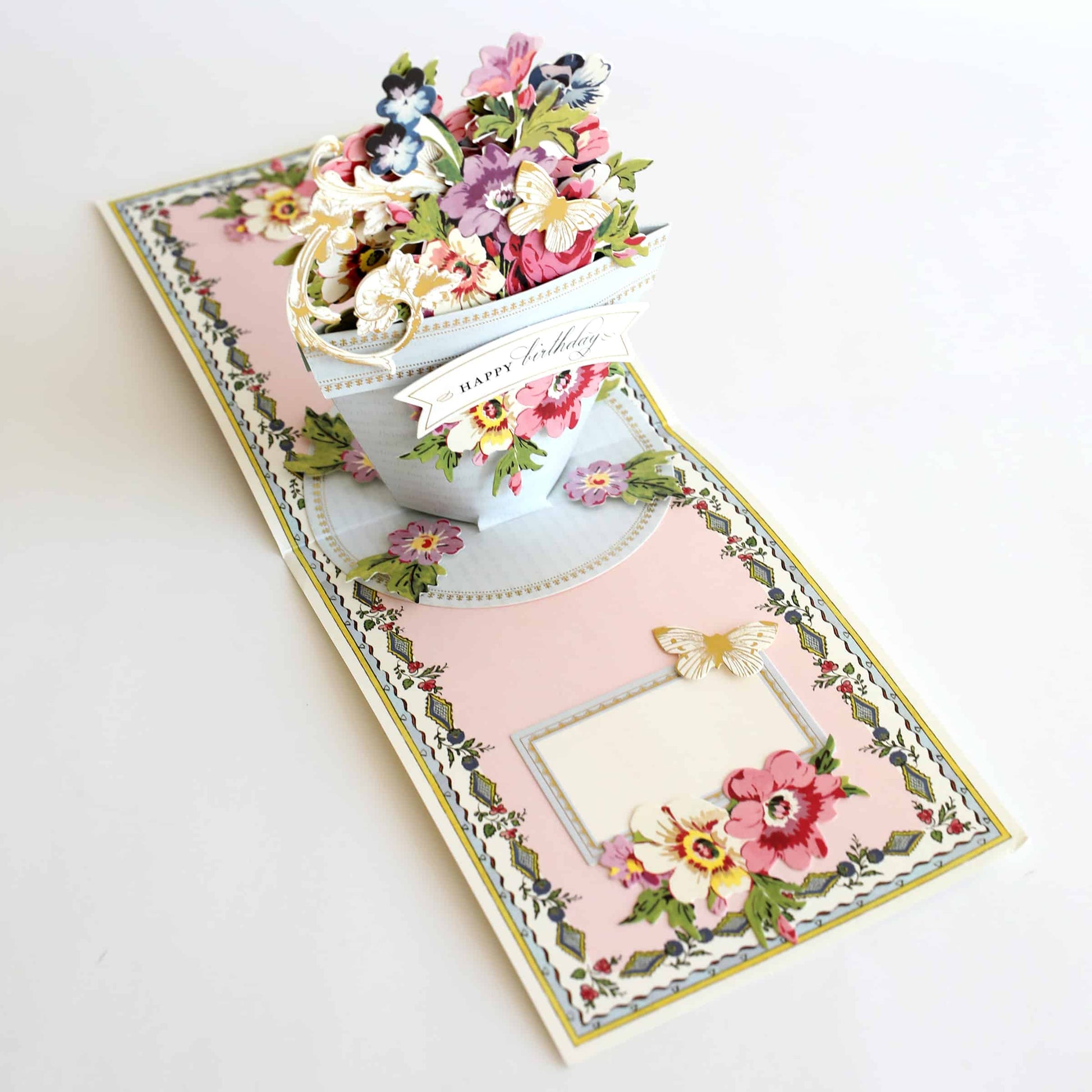 a card with a vase of flowers on it.