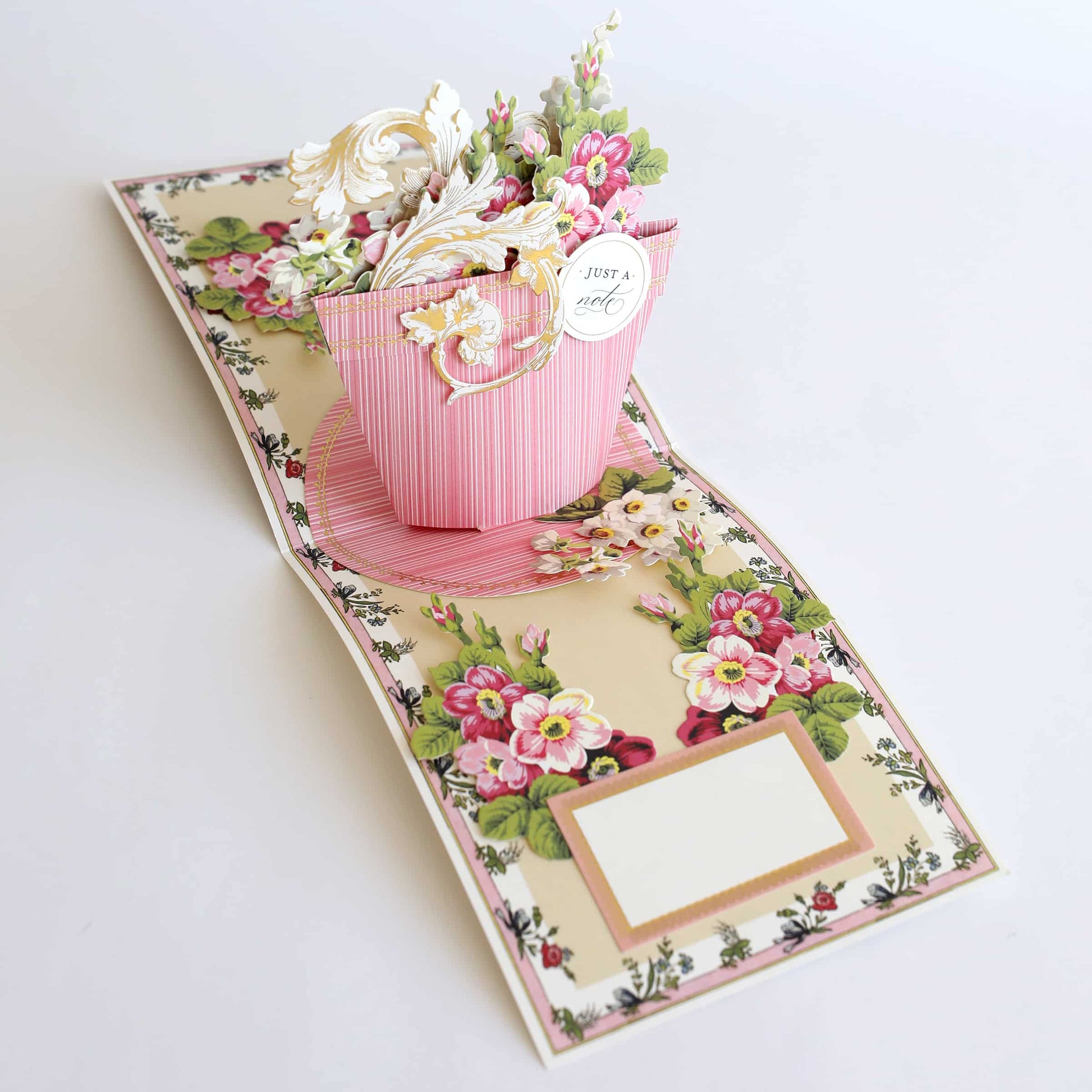 a card with a flower pot on it.