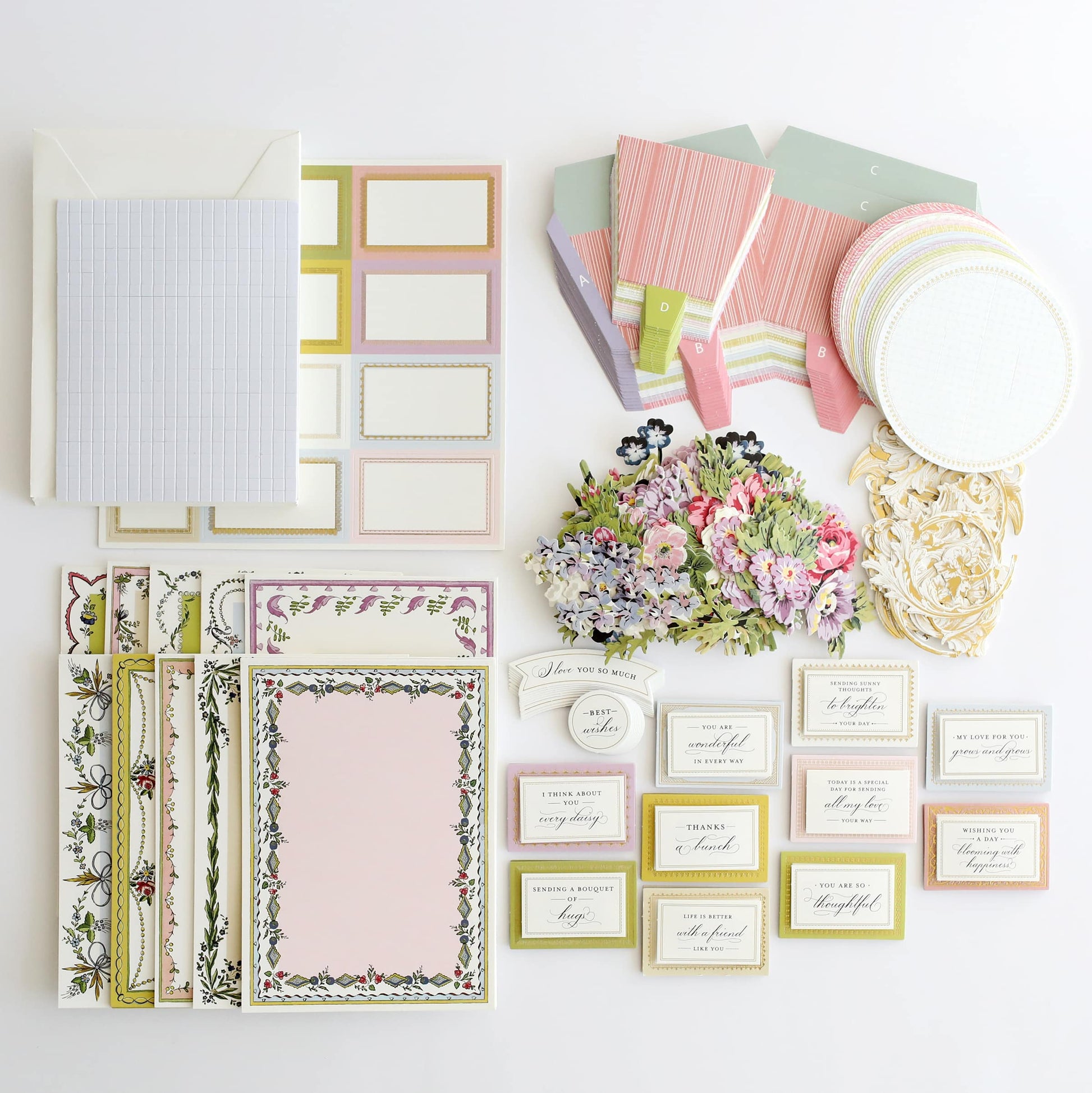 a variety of stationery items laid out on a table.