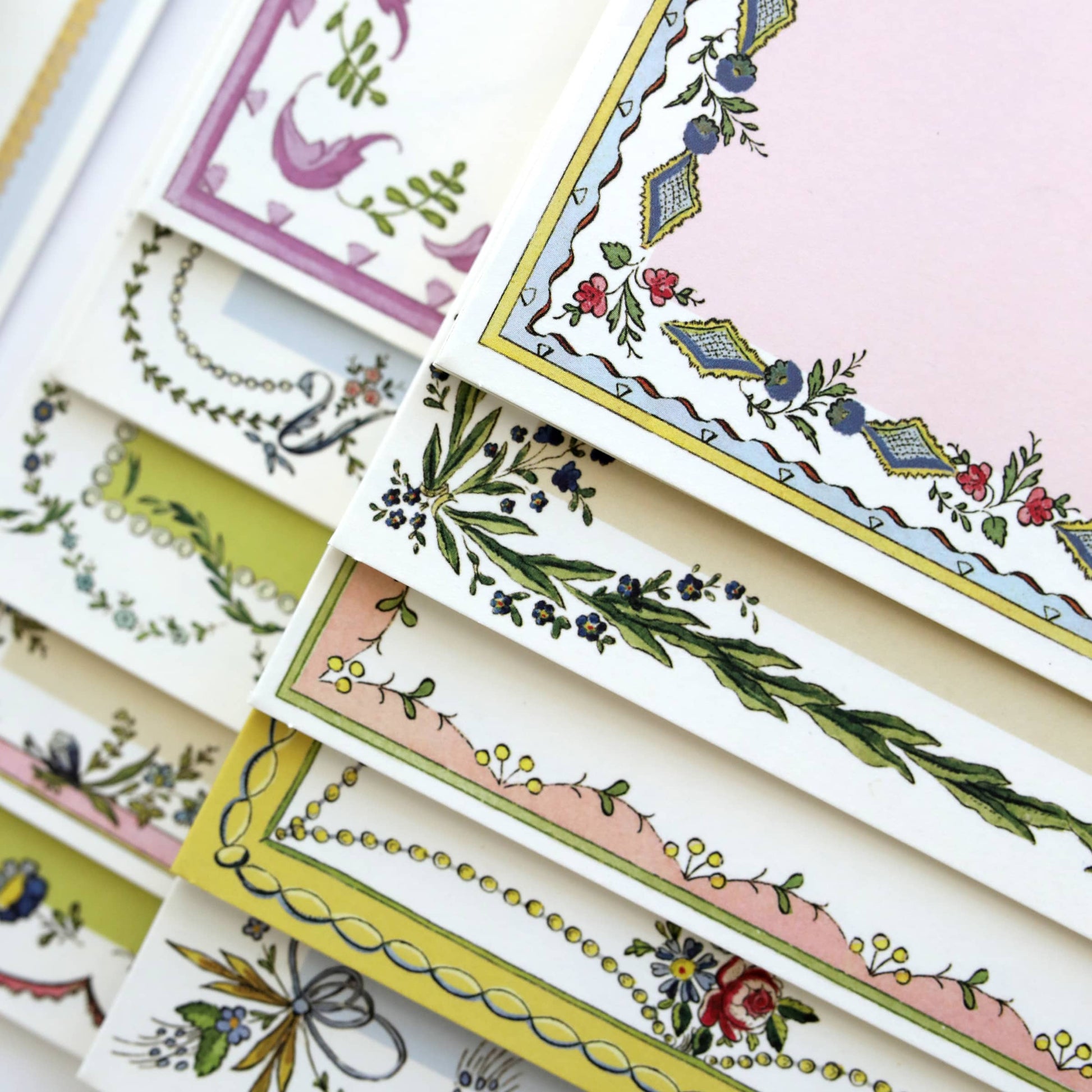 a pile of cards with different designs on them.