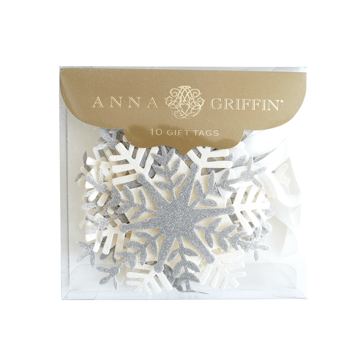 a white snowflake with a gold tag on it.