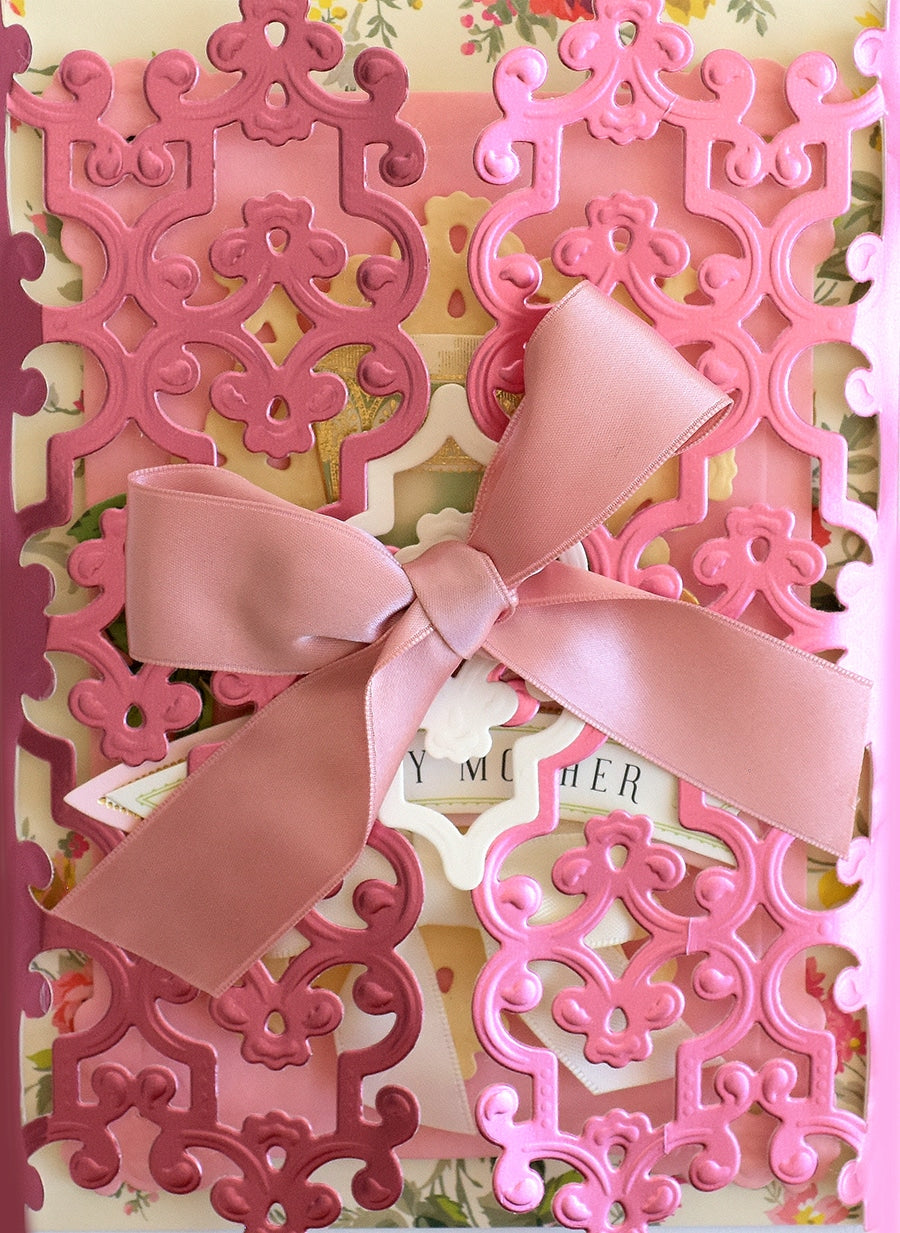 a close up of a card with a bow on it.