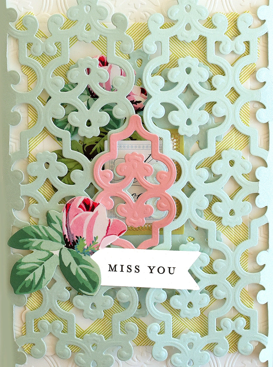 a close up of a card with flowers.