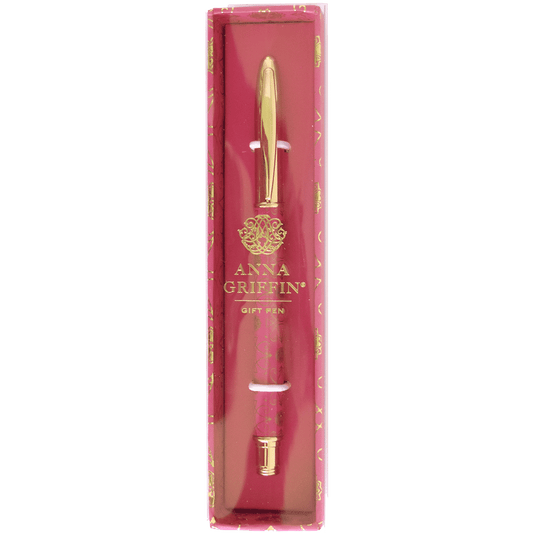 a pink box with a gold pen in it.